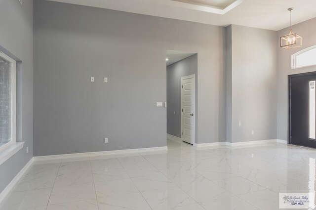 foyer with a chandelier