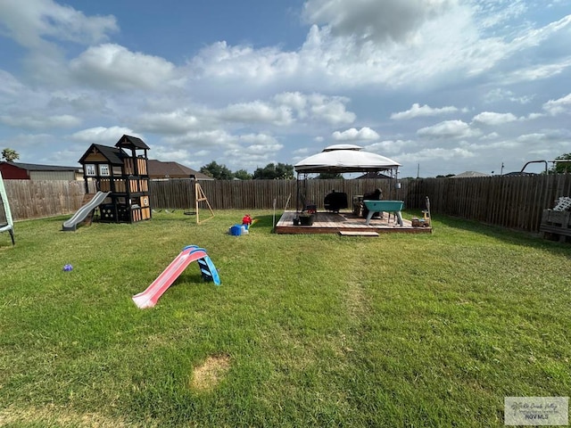 view of playground featuring a gazebo, a fenced backyard, and a yard