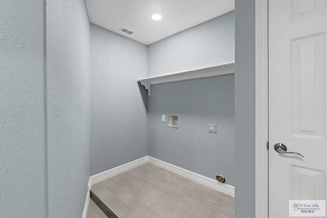 27859 Mile 3, La Feria, TX 78559 - washroom featuring baseboards, washer hookup, and recessed lighting