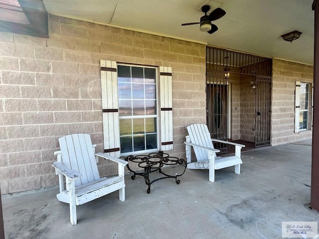 view of patio with ceiling fan