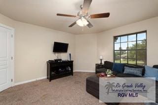 living room featuring carpet and ceiling fan