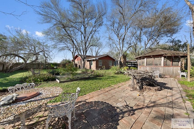 view of yard featuring a gazebo and a patio area