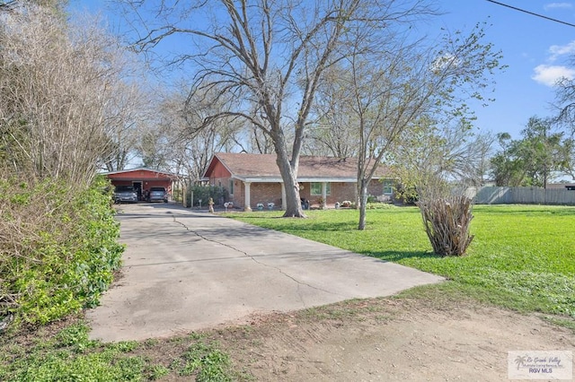 single story home featuring a front yard