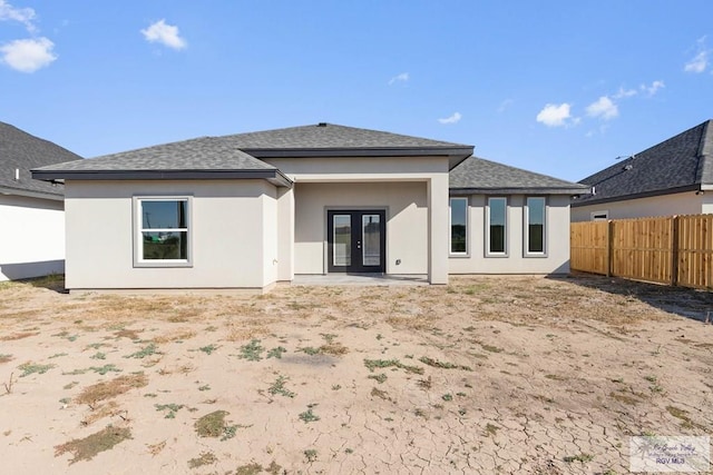 rear view of property with french doors