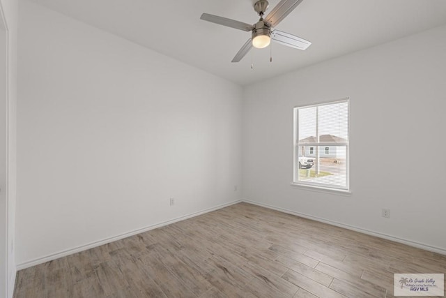 spare room with ceiling fan and light hardwood / wood-style flooring