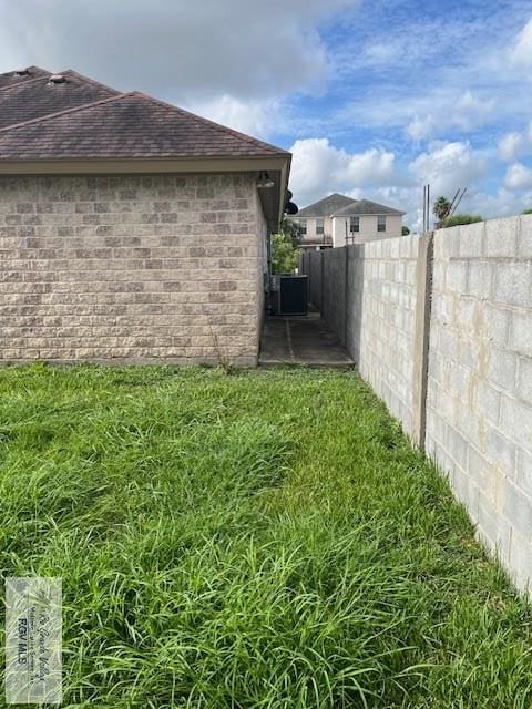 view of property exterior with central AC and a patio area