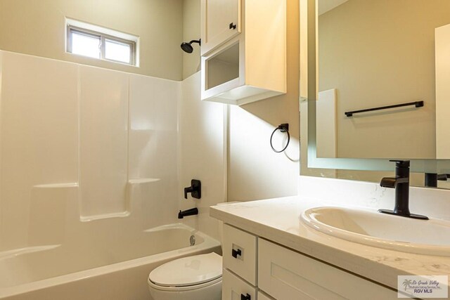 8801 Swan Lake Dr # 24, Harlingen, TX 78552 - bathroom with toilet, shower / bathing tub combination, and vanity