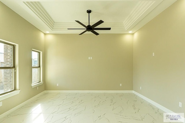 8801 Swan Lake Dr # 24, Harlingen, TX 78552 - spare room with ceiling fan, baseboards, marble finish floor, a tray ceiling, and crown molding