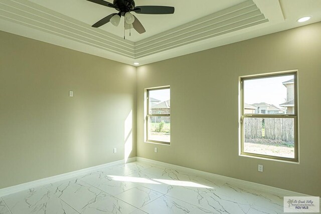 8801 Swan Lake Dr # 24, Harlingen, TX 78552 - spare room with recessed lighting, a ceiling fan, baseboards, marble finish floor, and a tray ceiling