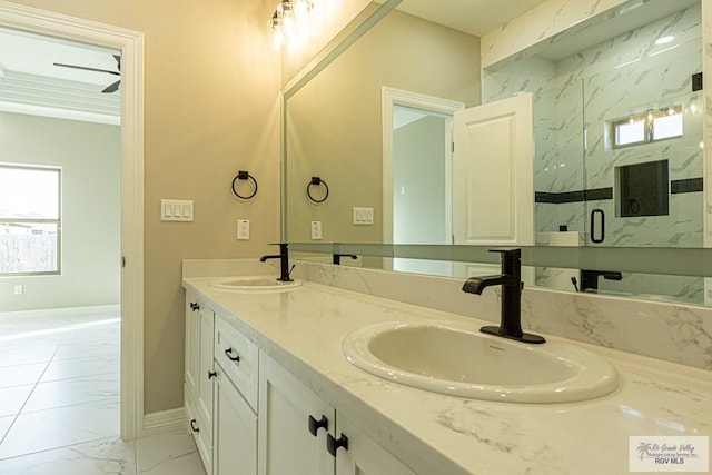 8801 Swan Lake Dr # 24, Harlingen, TX 78552 - bathroom with marble finish floor, double vanity, a sink, and a marble finish shower