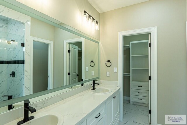 8801 Swan Lake Dr # 24, Harlingen, TX 78552 - full bath with marble finish floor, a spacious closet, a marble finish shower, and a sink