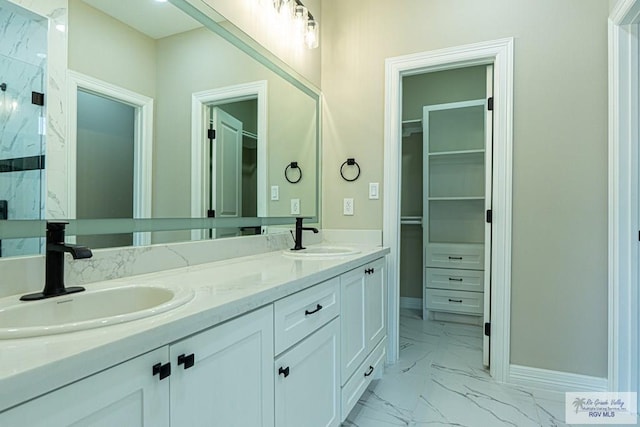 8801 Swan Lake Dr # 24, Harlingen, TX 78552 - full bath with marble finish floor, a marble finish shower, a walk in closet, and a sink