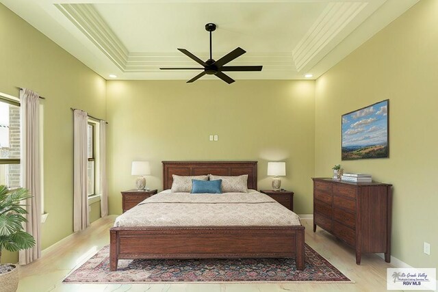 8801 Swan Lake Dr # 24, Harlingen, TX 78552 - bedroom with light wood-style floors, baseboards, a tray ceiling, and ornamental molding