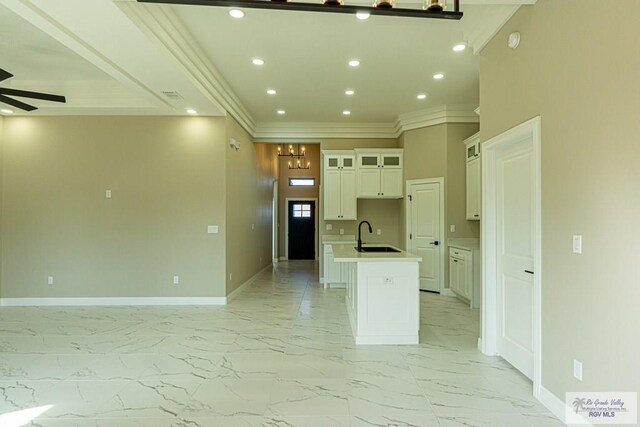 8801 Swan Lake Dr # 24, Harlingen, TX 78552 - kitchen featuring open floor plan, marble finish floor, and an island with sink