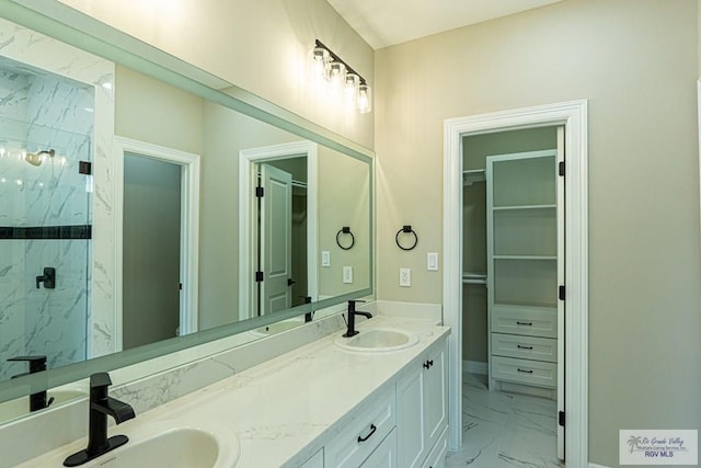 8801 Swan Lake Dr # 24, Harlingen, TX 78552 - bathroom featuring marble finish floor, a sink, a spacious closet, and a marble finish shower