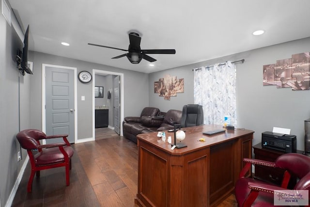 office space featuring ceiling fan and dark wood-type flooring