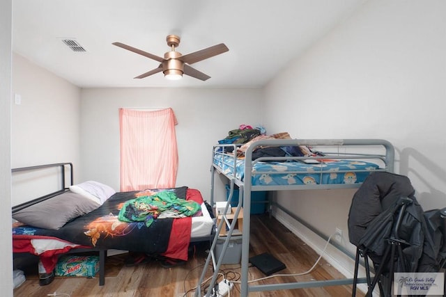 bedroom featuring ceiling fan and wood-type flooring