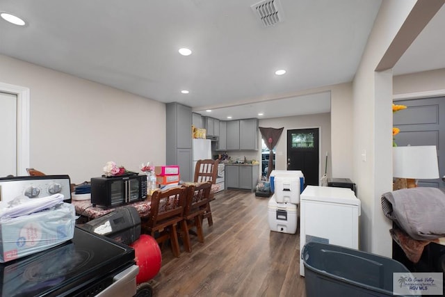 dining space with dark wood-type flooring