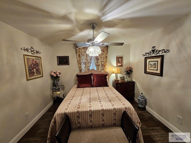 bedroom featuring dark hardwood / wood-style floors and ceiling fan