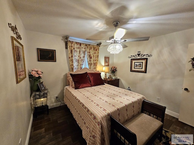 bedroom with ceiling fan and dark hardwood / wood-style flooring