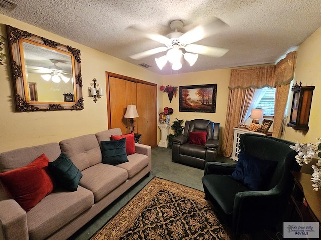 living room featuring carpet and a textured ceiling