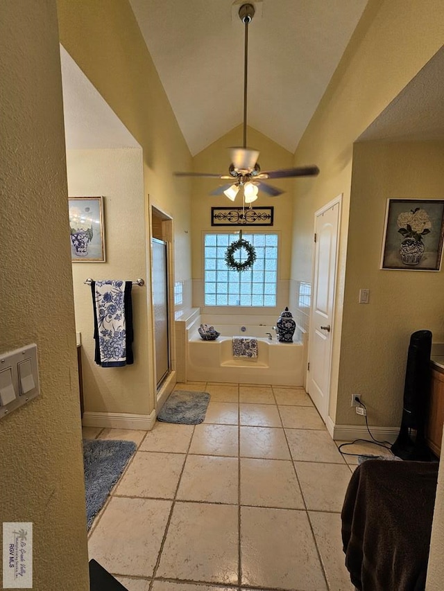 bathroom featuring tile patterned flooring, vaulted ceiling, ceiling fan, and independent shower and bath