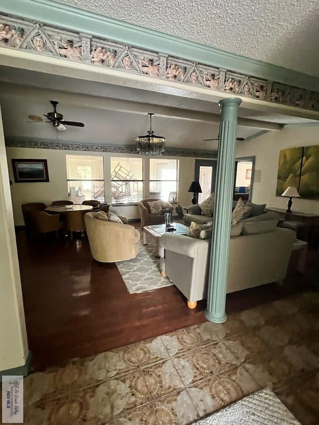 35 Alvarado Ave, Rancho Viejo, TX 78575 - living area with ornate columns, ceiling fan, wood finished floors, and a chandelier