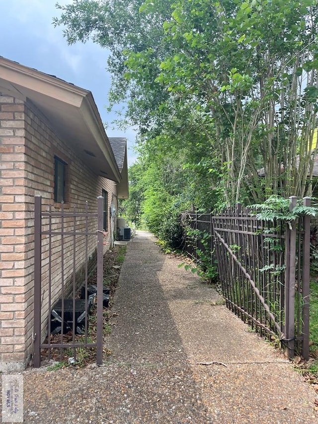 35 Alvarado Ave, Rancho Viejo, TX 78575 - view of side of home with brick siding