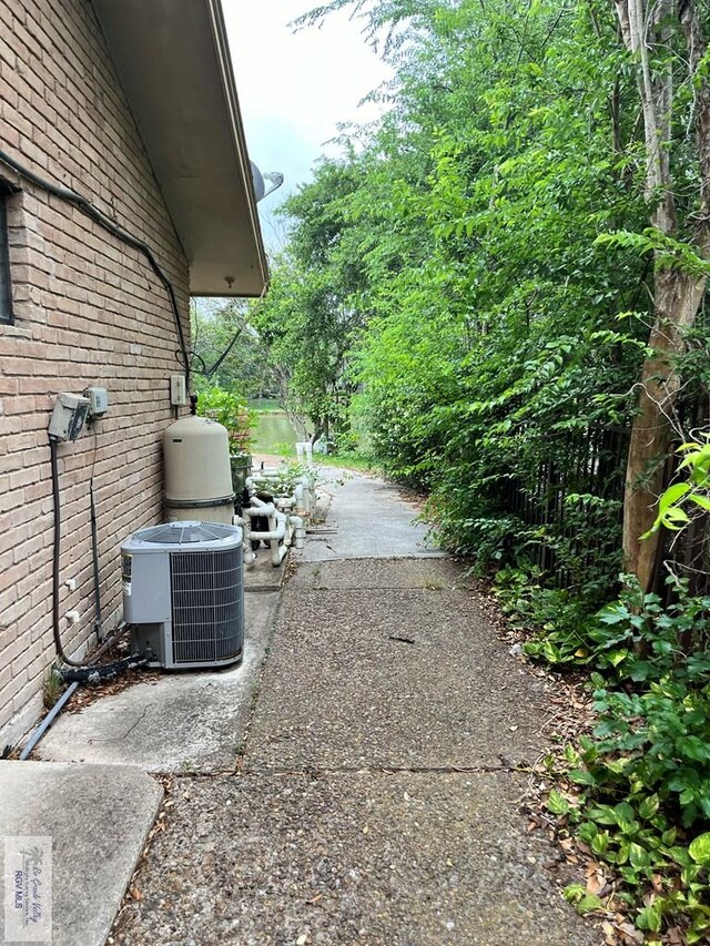 35 Alvarado Ave, Rancho Viejo, TX 78575 - view of side of home with brick siding