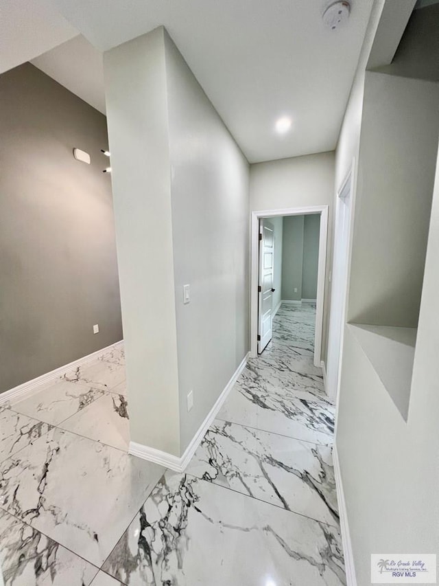 406 Valle Alto Dr, Los Fresnos, TX 78566 - corridor featuring marble look tile flooring and baseboards