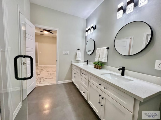 406 Valle Alto Dr, Los Fresnos, TX 78566 - bathroom with double vanity, marble finish floors, and a ceiling fan
