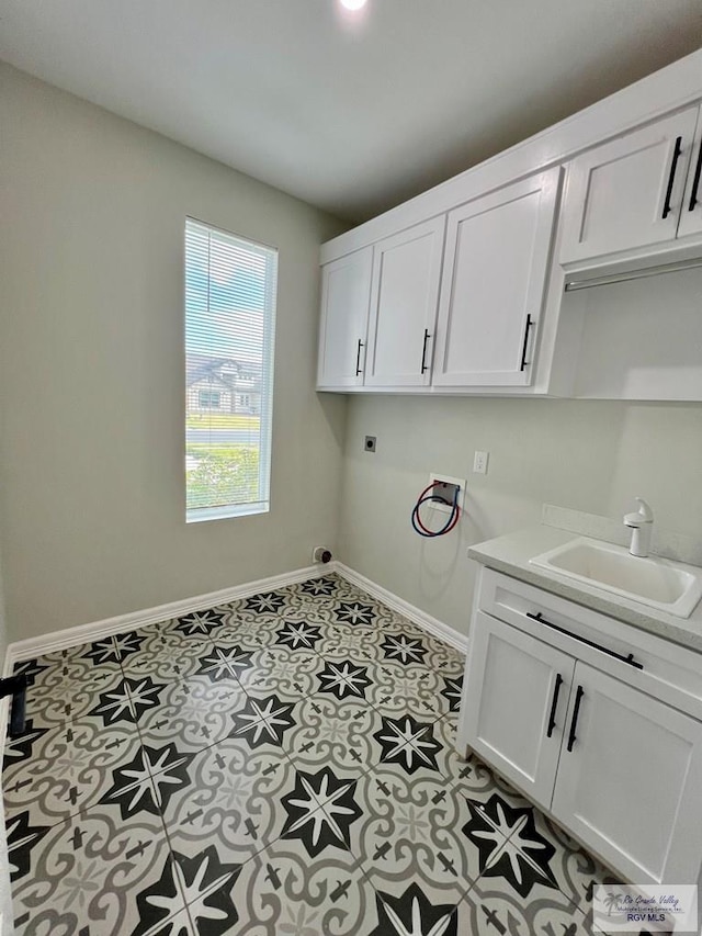 406 Valle Alto Dr, Los Fresnos, TX 78566 - washroom with electric dryer hookup, cabinet space, and hookup for a washing machine