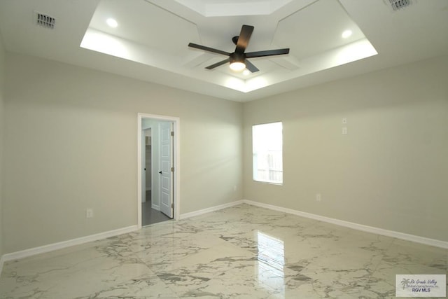 406 Valle Alto Dr, Los Fresnos, TX 78566 - unfurnished room featuring ceiling fan, a tray ceiling, light marble finish flooring, and recessed lighting