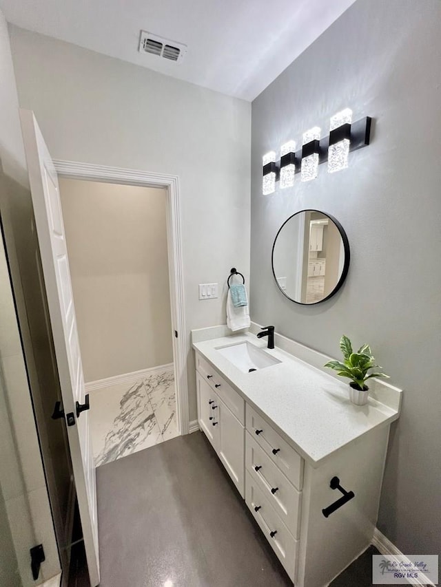 406 Valle Alto Dr, Los Fresnos, TX 78566 - bathroom featuring marble finish flooring and vanity