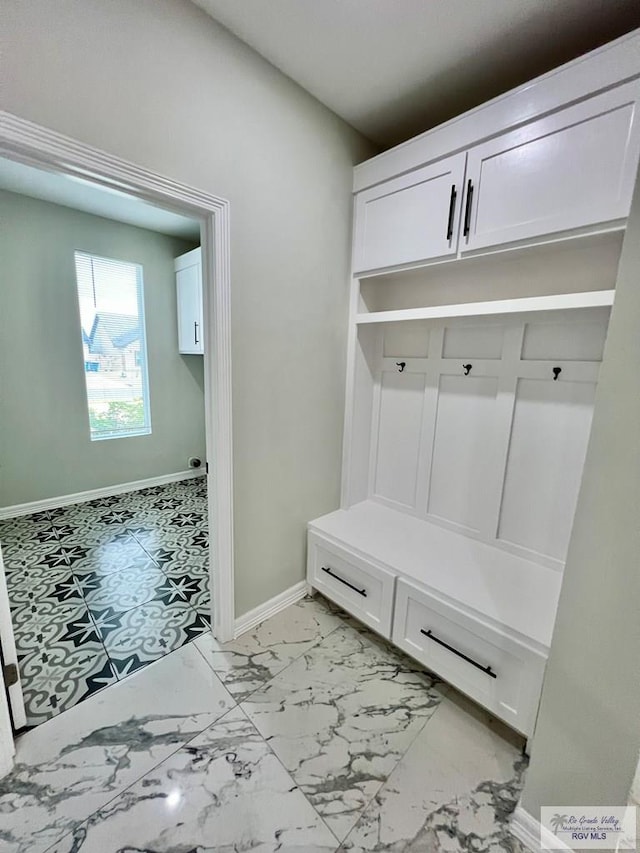 406 Valle Alto Dr, Los Fresnos, TX 78566 - mudroom featuring baseboards and light marble finish flooring