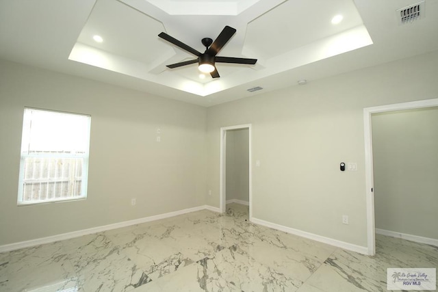 406 Valle Alto Dr, Los Fresnos, TX 78566 - empty room with a tray ceiling, a ceiling fan, light marble finish flooring, and recessed lighting
