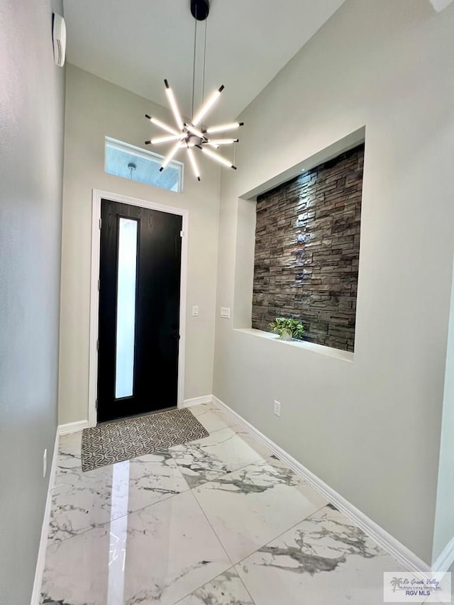 406 Valle Alto Dr, Los Fresnos, TX 78566 - foyer featuring marble finish floors and a towering ceiling