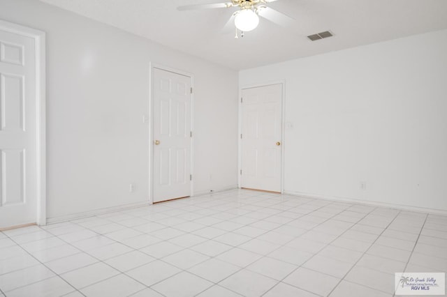 spare room with ceiling fan