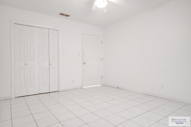 unfurnished bedroom featuring a closet and ceiling fan