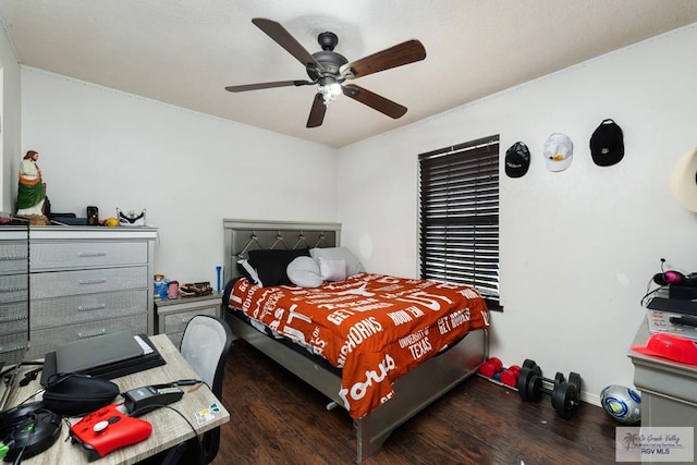 bedroom featuring wood finished floors and a ceiling fan