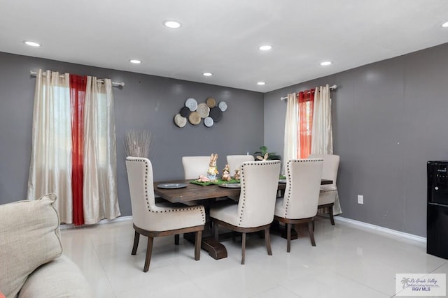 dining space featuring recessed lighting, baseboards, and tile patterned floors