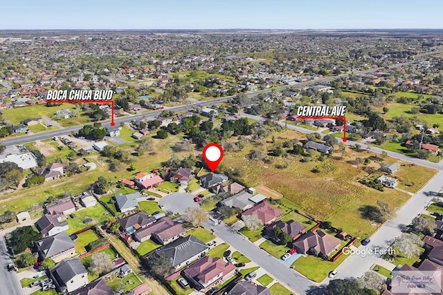 birds eye view of property with a residential view