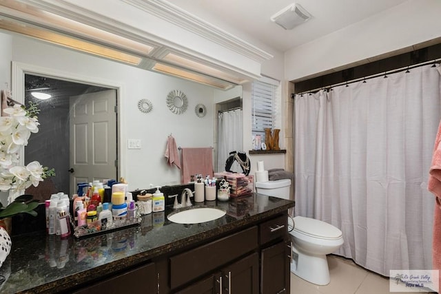 bathroom featuring toilet, tile patterned flooring, vanity, and visible vents