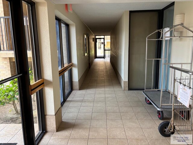 110 Padre Blvd Unit 407, South Padre Island, TX 78597 - hallway featuring light tile patterned flooring