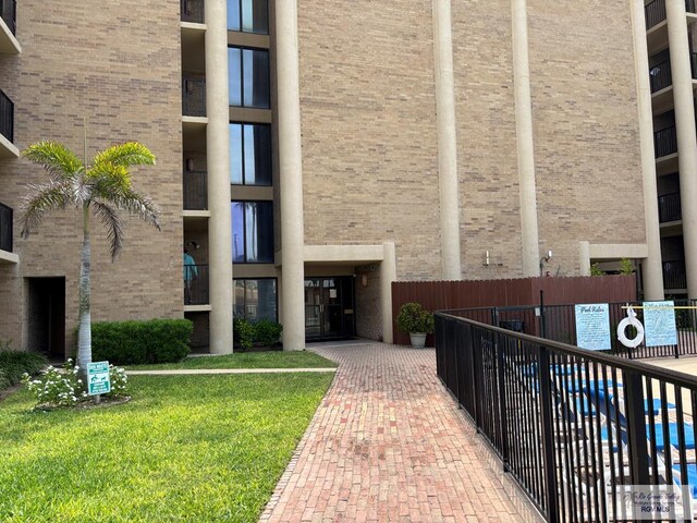 110 Padre Blvd Unit 407, South Padre Island, TX 78597 - view of property featuring fence
