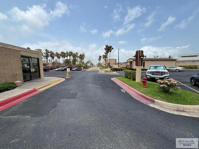 110 Padre Blvd Unit 407, South Padre Island, TX 78597 - view of street with curbs and a residential view