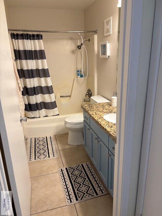 110 Padre Blvd Unit 407, South Padre Island, TX 78597 - full bath with tile patterned floors, visible vents, toilet, vanity, and shower / bath combo with shower curtain