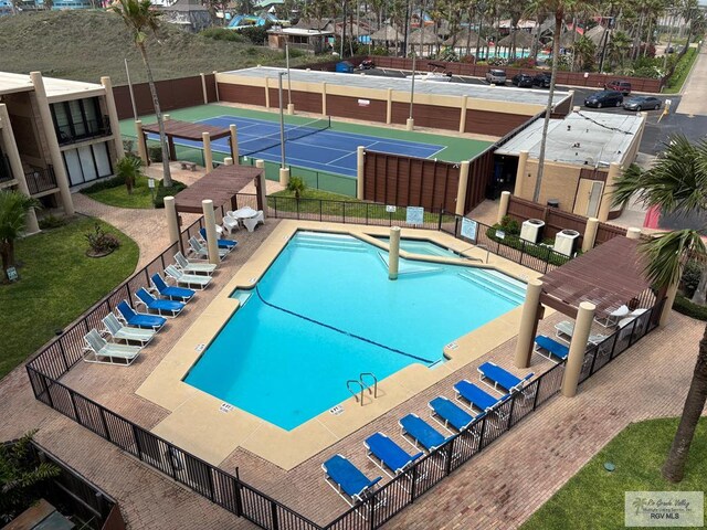 110 Padre Blvd Unit 407, South Padre Island, TX 78597 - pool featuring fence and a hot tub
