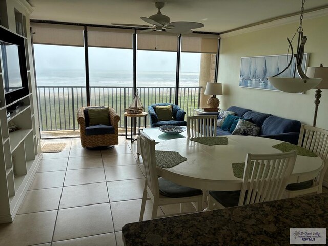 sunroom / solarium featuring a water view