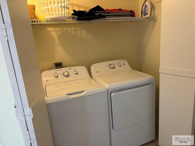 110 Padre Blvd Unit 407, South Padre Island, TX 78597 - laundry room featuring washing machine and dryer and laundry area